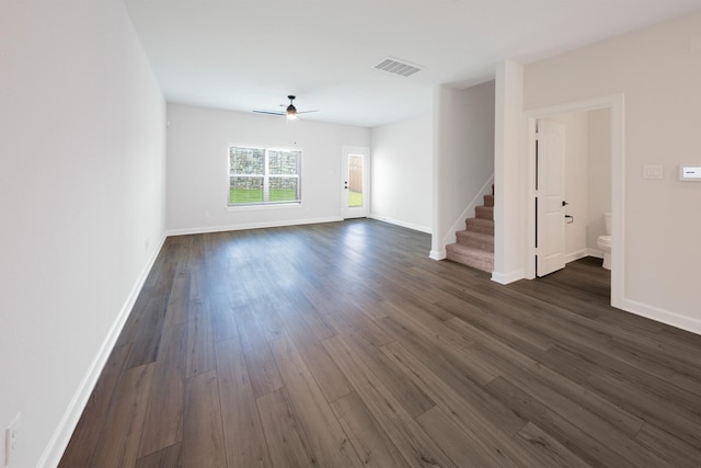 6171 White Spruce Dr, Conroe, TX 77304 - unfurnished living room with stairway, dark wood-style flooring, baseboards, and a ceiling fan