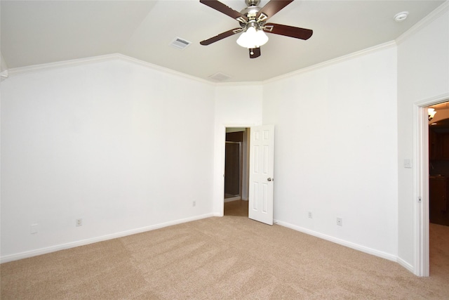 unfurnished bedroom featuring light colored carpet, baseboards, lofted ceiling, crown molding, and ceiling fan