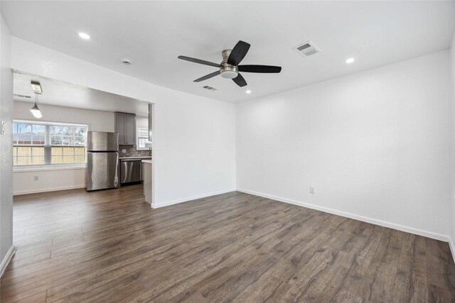 508 Kalmer St, Pasadena, TX 77502 - unfurnished living room with dark wood-style flooring, baseboards, ceiling fan, and recessed lighting