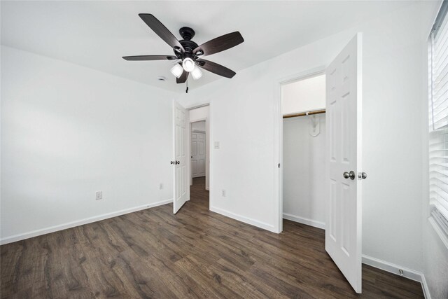 508 Kalmer St, Pasadena, TX 77502 - unfurnished bedroom featuring dark wood-style flooring, baseboards, a ceiling fan, and a closet