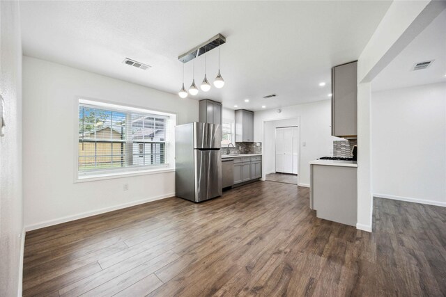 508 Kalmer St, Pasadena, TX 77502 - kitchen with stainless steel appliances, gray cabinets, decorative backsplash, healthy amount of natural light, and recessed lighting