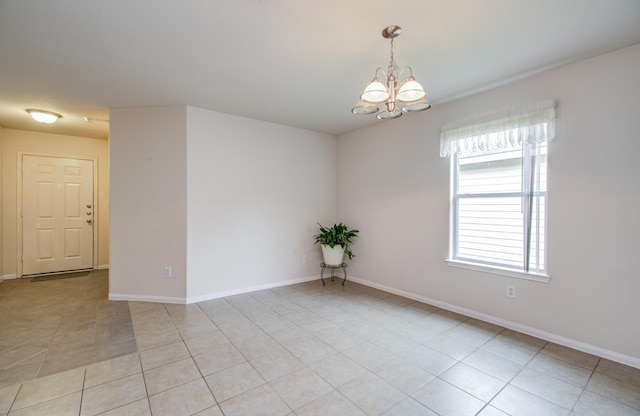 10406 Tenleyton Ln, Houston, TX 77075 - unfurnished room featuring a chandelier, light tile patterned floors, and baseboards