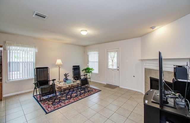 10406 Tenleyton Ln, Houston, TX 77075 - sitting room featuring plenty of natural light, light tile patterned floors, and a desk