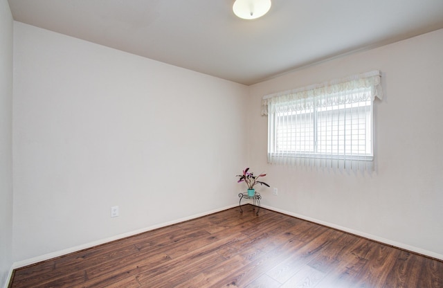 10406 Tenleyton Ln, Houston, TX 77075 - spare room featuring wood finished floors and baseboards