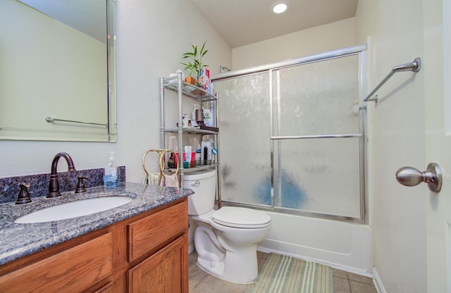 10406 Tenleyton Ln, Houston, TX 77075 - full bathroom with tile patterned flooring, vanity, toilet, and bath / shower combo with glass door