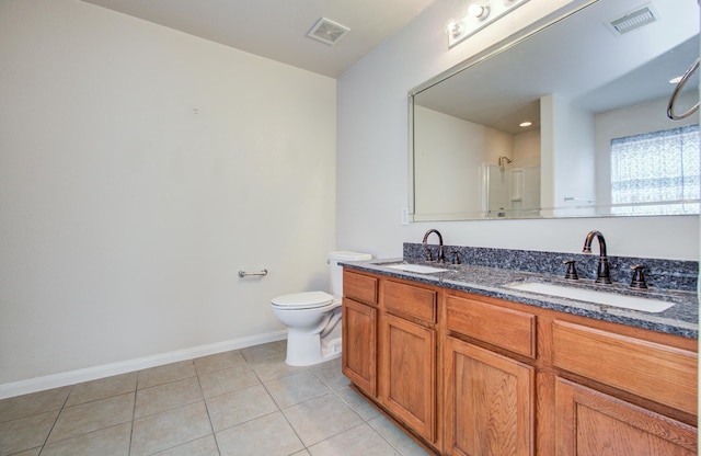 10406 Tenleyton Ln, Houston, TX 77075 - full bath with baseboards, tile patterned flooring, a shower, toilet, and double vanity