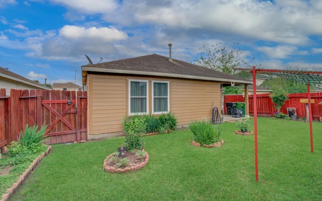 10406 Tenleyton Ln, Houston, TX 77075 - rear view of property featuring roof with shingles and a gate