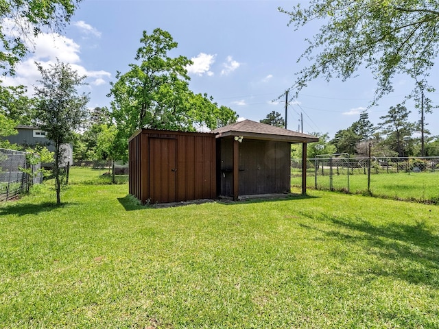 21007 Cook Rd, Tomball, TX 77377 - view of yard featuring a shed and an outdoor structure