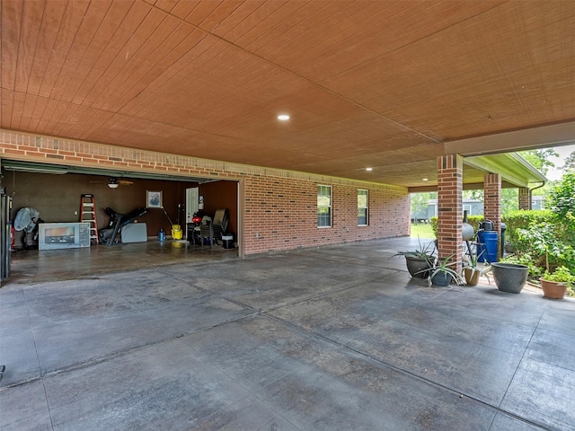 21007 Cook Rd, Tomball, TX 77377 - view of patio with a garage and concrete driveway