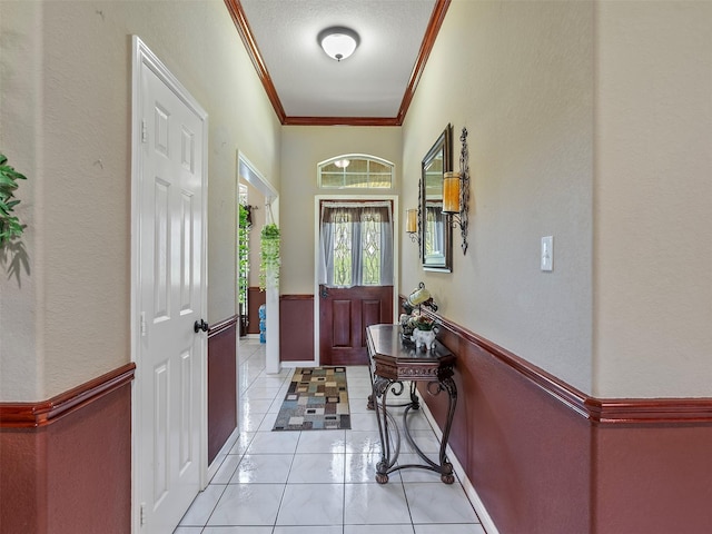 21007 Cook Rd, Tomball, TX 77377 - doorway to outside featuring ornamental molding, baseboards, and light tile patterned flooring