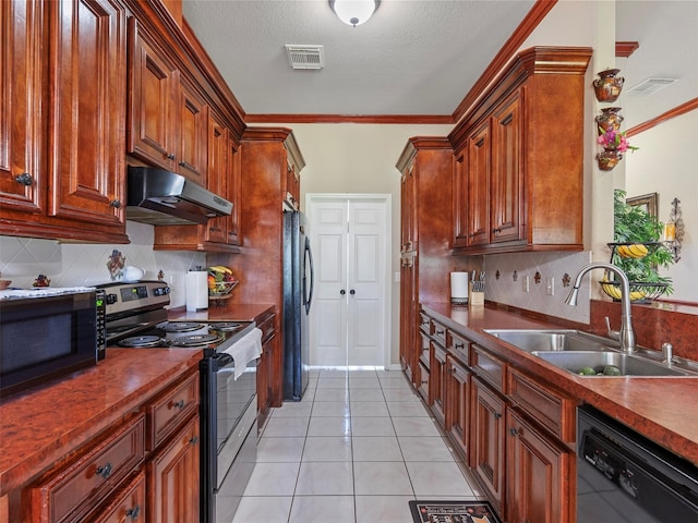 21007 Cook Rd, Tomball, TX 77377 - kitchen featuring black appliances, under cabinet range hood, a sink, dark countertops, and decorative backsplash