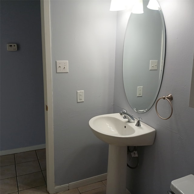 18 Townhouse Ln Unit 18, Trinity, TX 75862 - half bath with tile patterned flooring, toilet, and baseboards