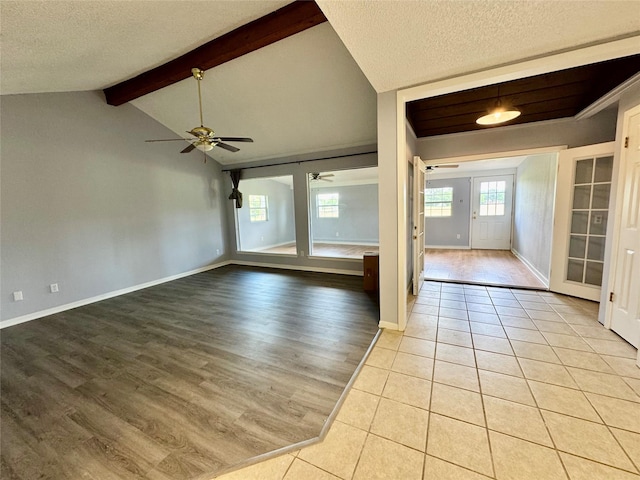 18 Townhouse Ln Unit 18, Trinity, TX 75862 - empty room featuring ceiling fan, a textured ceiling, light wood finished floors, and baseboards