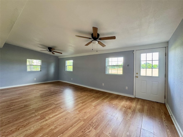 18 Townhouse Ln Unit 18, Trinity, TX 75862 - entrance foyer featuring healthy amount of natural light, wood finished floors, a ceiling fan, and baseboards