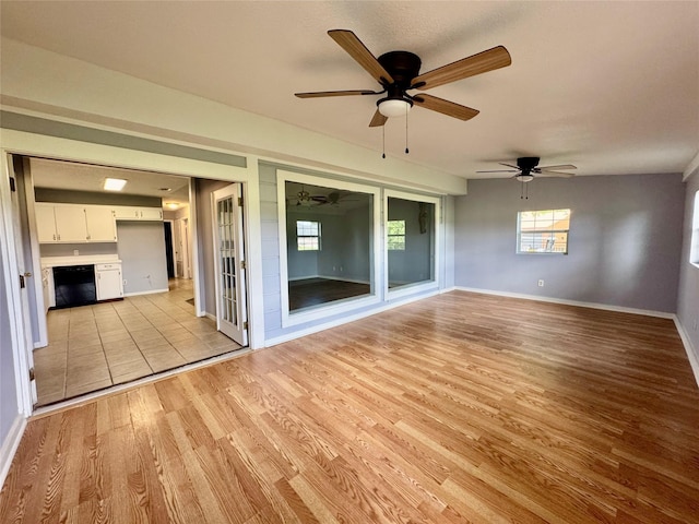 18 Townhouse Ln Unit 18, Trinity, TX 75862 - unfurnished room featuring light wood finished floors, ceiling fan, and baseboards