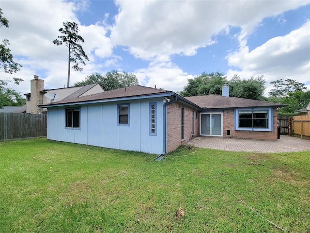 18515 Sweetmeadow Dr, Spring, TX 77379 - rear view of house with a patio area, a chimney, and brick siding