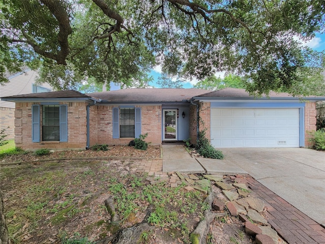 18515 Sweetmeadow Dr, Spring, TX 77379 - single story home featuring a garage, driveway, brick siding, and a shingled roof