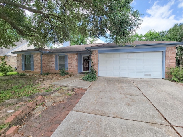 18515 Sweetmeadow Dr, Spring, TX 77379 - ranch-style house featuring driveway, brick siding, and a garage