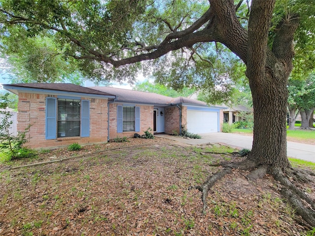 18515 Sweetmeadow Dr, Spring, TX 77379 - ranch-style home with driveway, a garage, and brick siding