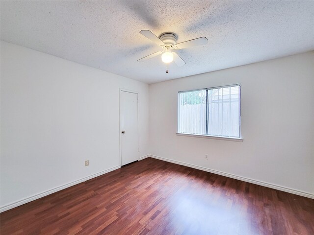 18515 Sweetmeadow Dr, Spring, TX 77379 - spare room with wood finished floors, a ceiling fan, a textured ceiling, and baseboards