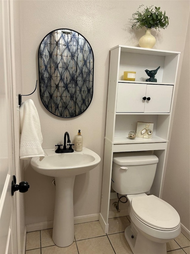 2610 Daugherty St, Waller, TX 77484 - half bathroom featuring toilet, baseboards, and tile patterned flooring
