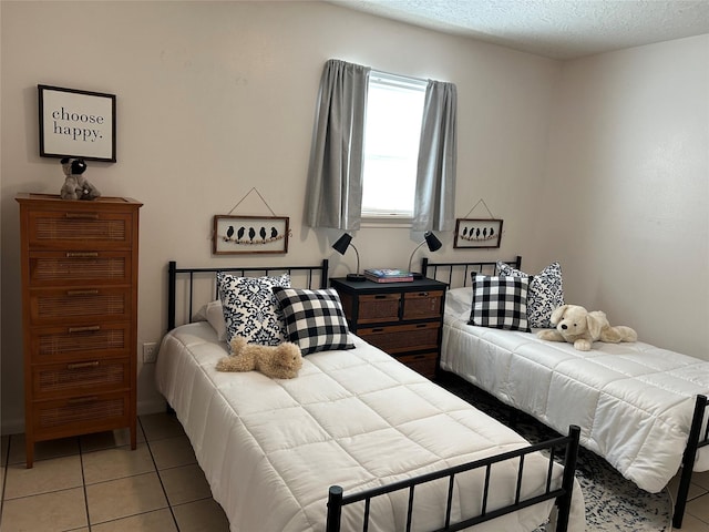 2610 Daugherty St, Waller, TX 77484 - bedroom with light tile patterned floors and a textured ceiling