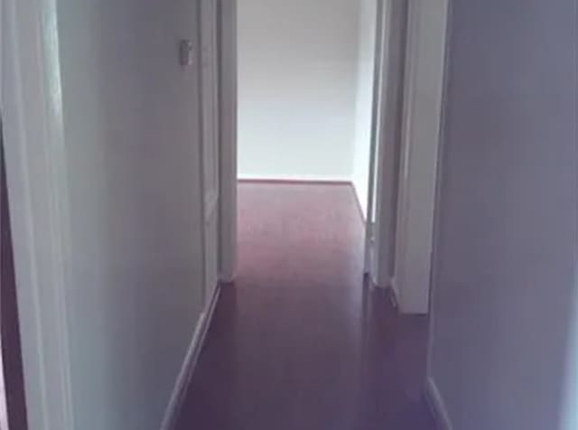 406 Poinsetta St, Lake Jackson, TX 77566 - corridor featuring baseboards
