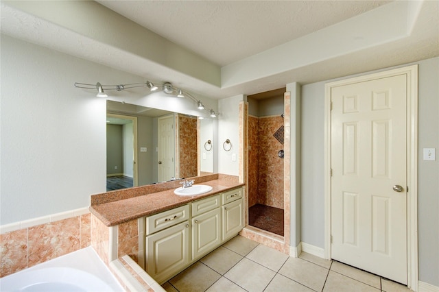 6613 Whitton Dr, Houston, TX 77085 - full bathroom with a tile shower, tile patterned floors, vanity, and a garden tub