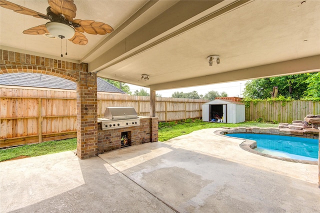 6613 Whitton Dr, Houston, TX 77085 - view of patio / terrace featuring area for grilling, exterior kitchen, a fenced backyard, and a storage unit