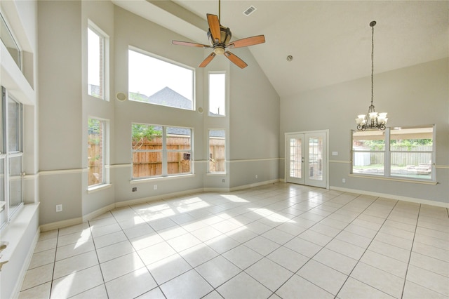 6613 Whitton Dr, Houston, TX 77085 - unfurnished living room with high vaulted ceiling, light tile patterned flooring, a chandelier, a ceiling fan, and baseboards