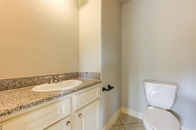 6613 Whitton Dr, Houston, TX 77085 - bathroom featuring tile patterned floors, toilet, vanity, and baseboards