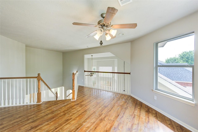 6613 Whitton Dr, Houston, TX 77085 - spare room featuring wood finished floors, ceiling fan, and baseboards