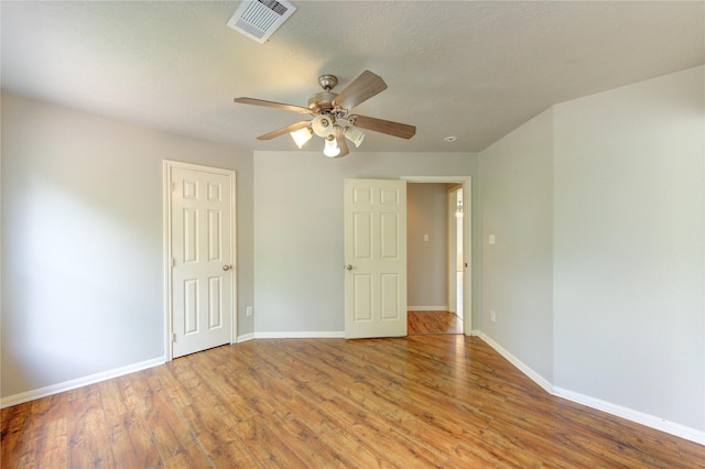6613 Whitton Dr, Houston, TX 77085 - spare room featuring a ceiling fan, wood finished floors, and baseboards