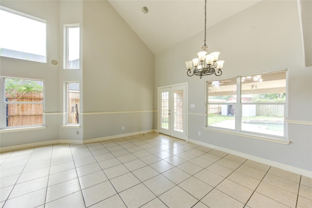 6613 Whitton Dr, Houston, TX 77085 - spare room with high vaulted ceiling, a chandelier, light tile patterned floors, and baseboards
