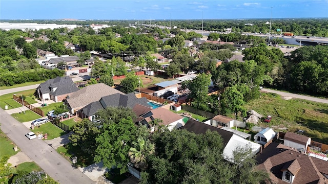 6613 Whitton Dr, Houston, TX 77085 - aerial overview of property's location featuring nearby suburban area and a tree filled landscape