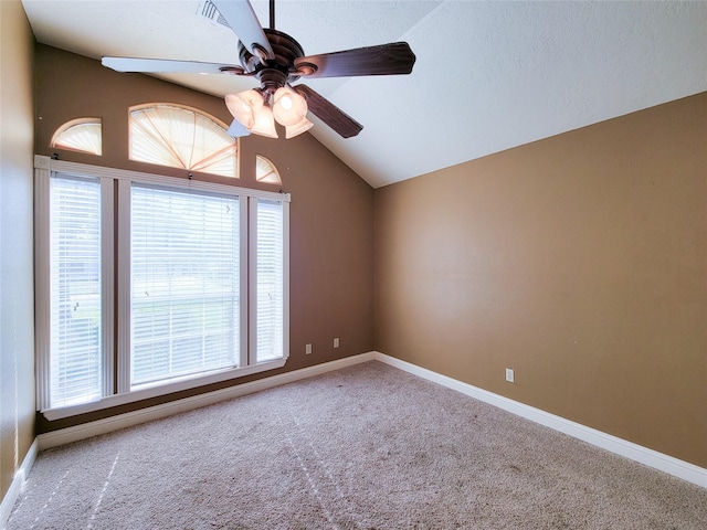 719 Partridge Ln, Eagle Lake, TX 77434 - empty room featuring ceiling fan, carpet, lofted ceiling, and baseboards