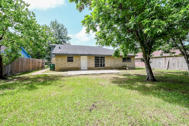 9923 Valley Sun Dr, Houston, TX 77078 - rear view of house with a patio area and brick siding