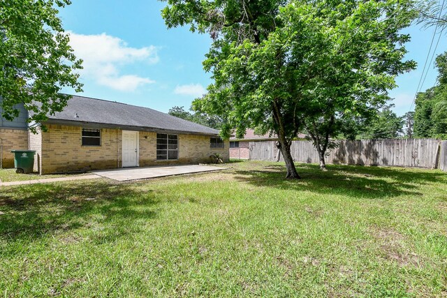 9923 Valley Sun Dr, Houston, TX 77078 - back of property featuring brick siding and a patio