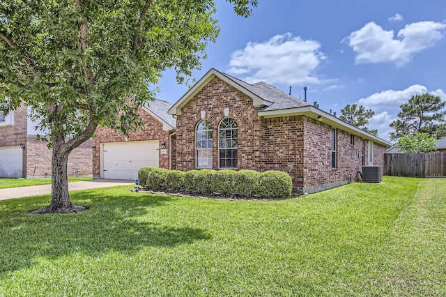 18115 Linden Forest Ln, Katy, TX 77449 - view of front of house with brick siding, a garage, driveway, a shingled roof, and cooling unit