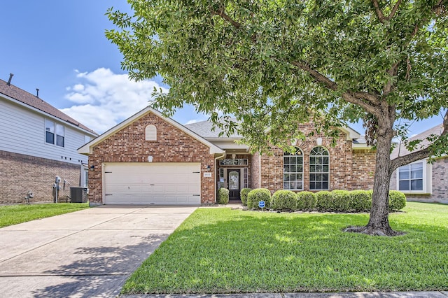 18115 Linden Forest Ln, Katy, TX 77449 - traditional home with cooling unit, a front yard, a garage, brick siding, and driveway