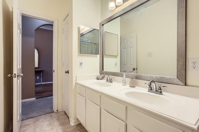 18115 Linden Forest Ln, Katy, TX 77449 - full bath with double vanity, tile patterned floors, and baseboards