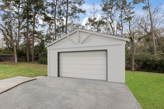 detached garage featuring driveway