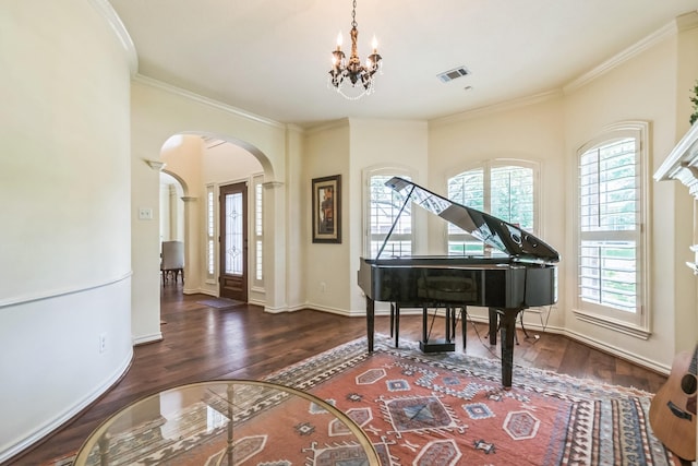 147 Sunnyvale W, Montgomery, TX 77356 - entrance foyer featuring arched walkways, wood finished floors, healthy amount of natural light, and ornamental molding