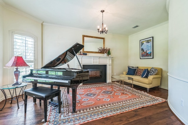 147 Sunnyvale W, Montgomery, TX 77356 - living area with hardwood / wood-style flooring, ornamental molding, a chandelier, baseboards, and a fireplace