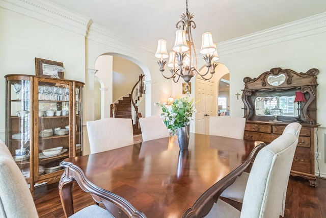 147 Sunnyvale W, Montgomery, TX 77356 - dining area with arched walkways, a chandelier, ornamental molding, dark wood finished floors, and stairway