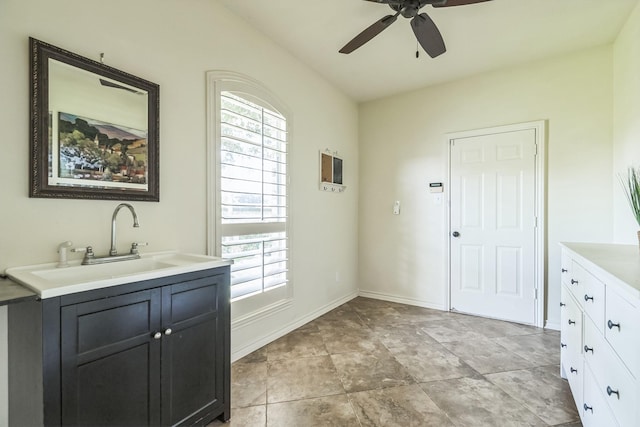 147 Sunnyvale W, Montgomery, TX 77356 - washroom featuring a sink, a ceiling fan, and baseboards