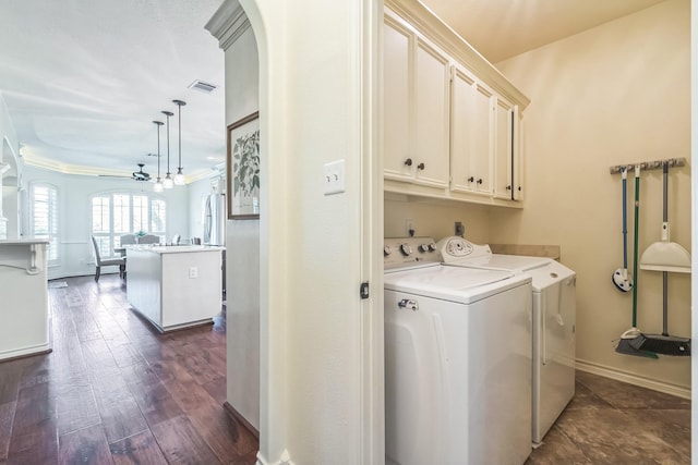 147 Sunnyvale W, Montgomery, TX 77356 - laundry room featuring cabinet space, independent washer and dryer, arched walkways, a chandelier, and baseboards