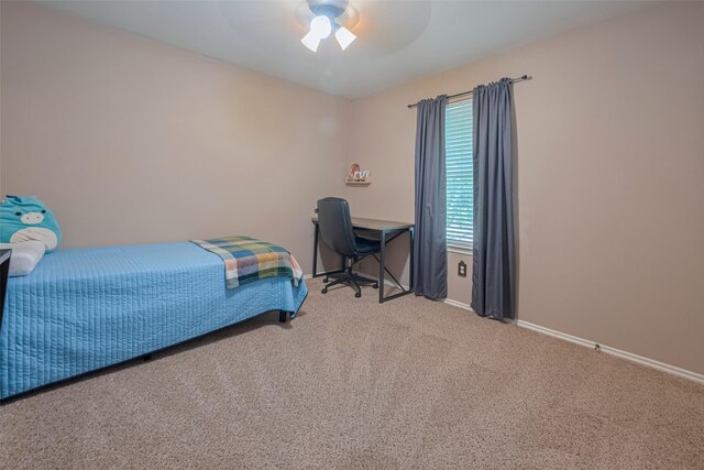bedroom with carpet floors, baseboards, and a ceiling fan