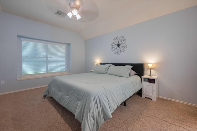 bedroom with light carpet, vaulted ceiling, baseboards, and ceiling fan