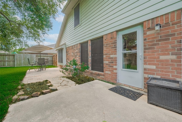 view of patio / terrace featuring fence and outdoor dining area